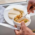 Home Delicious Nigerian breakfast with yam and egg dish in natural light.